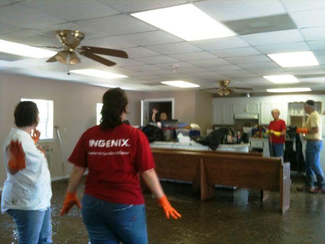 Here some ladies are cleaning out items from our former fellowship hall.  Rubber boots and gloves were a common sight that day.