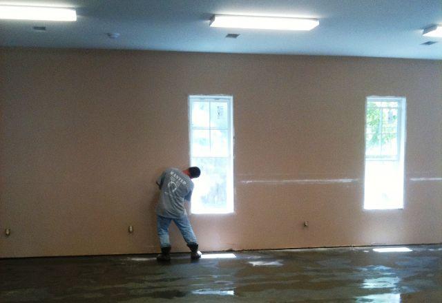 We had just completed painting in our new fellowship hall.  On the bright side, no appliances or furniture had yet been installed.  Here we begin to cut the drywall above the flood line, a first step toward restoration and repair.