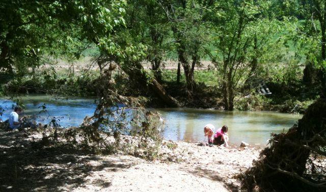When there weren't tasks for the kids to do, they'd take a break to play in the edge of the creek.  Such sights are a vivid reminder that life does go on, and joy can still be found in the goodness of God's creation.