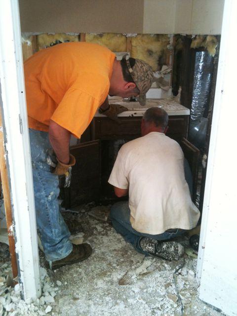 In the sanctuary building, work begins on ripping out the bathrooms.