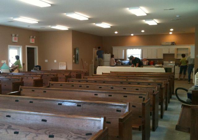 Many hands made light work getting set up for worship in our new building.  This space had served as storage during the past 2 months.  A small area near one end was used for children's church.  Even without air conditioning Fly Kids never complained.